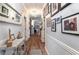 Long hallway with beautiful decor and a cohesive design at 101 Maddington Place Dr. # 103, Surfside Beach, SC 29575