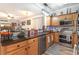 Bright kitchen featuring wooden cabinets, stainless steel appliances, and decorative backsplash at 101 Maddington Place Dr. # 103, Surfside Beach, SC 29575