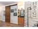 Charming living area featuring a modern sliding barn door and decorative wall art at 101 Maddington Place Dr. # 103, Surfside Beach, SC 29575
