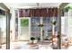Inviting sun room with walls of windows and hardwood floors providing lots of natural light at 101 Maddington Place Dr. # 103, Surfside Beach, SC 29575