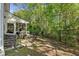 A patio area and fenced yard offer outdoor living space with surrounding lush greenery and beautiful views at 1064 Penny Ln. # 1064, Myrtle Beach, SC 29577