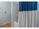 Clean bathroom with shower-tub combination and a white and blue curtain at 1064 Penny Ln. # 1064, Myrtle Beach, SC 29577
