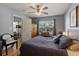 Bedroom featuring hardwood floors, ceiling fan, and access to an adjoining room through an open door at 1064 Penny Ln. # 1064, Myrtle Beach, SC 29577