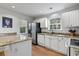 Modern kitchen boasts stainless steel appliances, granite counters, and white cabinetry at 1064 Penny Ln. # 1064, Myrtle Beach, SC 29577