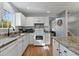 Bright kitchen features white cabinets, granite countertops, and stainless steel appliances at 1064 Penny Ln. # 1064, Myrtle Beach, SC 29577