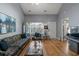 Bright living room featuring a large window, stylish furniture, and hardwood floors at 1064 Penny Ln. # 1064, Myrtle Beach, SC 29577