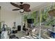 Enclosed porch with ceiling fan, a door to the backyard, and ample space for storage or seating at 1064 Penny Ln. # 1064, Myrtle Beach, SC 29577