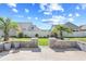Backyard patio with a retaining wall and lush landscaping, perfect for outdoor entertaining at 1239 Pyxie Moss Dr., Little River, SC 29566