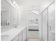 Bright bathroom showcasing double vanity and glass shower at 1239 Pyxie Moss Dr., Little River, SC 29566