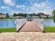 Community catch and release fishing pier featuring a wooden deck, bench seating and lush landscaping at 1239 Pyxie Moss Dr., Little River, SC 29566