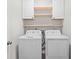 A functional laundry room featuring a side-by-side washer and dryer at 1239 Pyxie Moss Dr., Little River, SC 29566