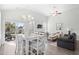 Open-concept living and dining area with wood floors and modern decor at 1239 Pyxie Moss Dr., Little River, SC 29566