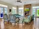 Community lounge featuring a fireplace, comfortable seating, and scenic outdoor views at 1239 Pyxie Moss Dr., Little River, SC 29566