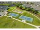Aerial view of the community pickleball courts and bocce ball court surrounded by lush landscaping at 1239 Pyxie Moss Dr., Little River, SC 29566