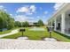 Community putting green and picnic grills next to the clubhouse and walking paths at 1239 Pyxie Moss Dr., Little River, SC 29566