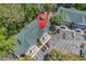 Aerial view of condominiums and a parking lot, set among lush green trees on a bright, sunny day at 157 Egret Run Ln. # 514, Pawleys Island, SC 29585