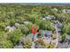Scenic aerial view of condominiums surrounded by lush trees, near a picturesque coastline and ocean at 157 Egret Run Ln. # 514, Pawleys Island, SC 29585