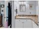 Well-lit bathroom featuring granite countertops, drawers, and a large mirror, and a closet at 157 Egret Run Ln. # 514, Pawleys Island, SC 29585