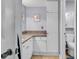 Bright bathroom featuring a tiled floor, white cabinets, a granite countertop, and toilet with nearby shower at 157 Egret Run Ln. # 514, Pawleys Island, SC 29585