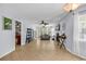 Open-concept living room featuring neutral walls, tile flooring, fireplace, and access to kitchen area at 157 Egret Run Ln. # 514, Pawleys Island, SC 29585
