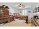 Cozy main bedroom showcasing an antique dresser, ceiling fan, and comfortable queen sized bed at 157 Egret Run Ln. # 514, Pawleys Island, SC 29585