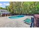 Community pool area featuring a fenced-in pool with a brick paved surround and lounge chairs at 157 Egret Run Ln. # 514, Pawleys Island, SC 29585