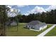 View of backyard featuring a patio, lawn, and white fence surrounding the property at 161 Penn Circle, Galivants Ferry, SC 29544
