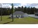 Spacious backyard featuring a small patio area, perfect for outdoor dining and entertaining at 161 Penn Circle, Galivants Ferry, SC 29544