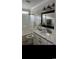 Bathroom featuring a white vanity with granite countertop and a shower-tub combo at 161 Penn Circle, Galivants Ferry, SC 29544