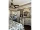 Comfortable bedroom with a vintage dresser and ample storage with a ceiling fan and stylish decor at 161 Penn Circle, Galivants Ferry, SC 29544