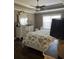 Serene bedroom featuring a decorative dresser and floral bedding creating a calm, comfortable space at 161 Penn Circle, Galivants Ferry, SC 29544