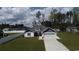 Charming one-story home with a two-car garage, white picket fence, and a well-manicured lawn at 161 Penn Circle, Galivants Ferry, SC 29544