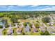 Aerial view of a community near a golf course and a pond at 174 Seville Dr., Murrells Inlet, SC 29576