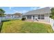 Backyard with a patio, green lawn, and a privacy fence at 174 Seville Dr., Murrells Inlet, SC 29576