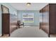 Well-lit bedroom with a large window, two dressers, and a comfortable chair at 174 Seville Dr., Murrells Inlet, SC 29576