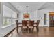 Dining room featuring hardwood floors, a pendant light, and large window at 174 Seville Dr., Murrells Inlet, SC 29576