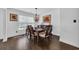 Dining room with hardwood floors and a pendant light above a wooden table at 174 Seville Dr., Murrells Inlet, SC 29576