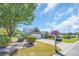 Home exterior with an expansive lawn, driveway, and tasteful landscaping surrounding the house at 174 Seville Dr., Murrells Inlet, SC 29576