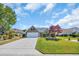 Beautifully maintained yard with lush green grass, manicured shrubs, and an inviting driveway at 174 Seville Dr., Murrells Inlet, SC 29576