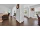 Hallway with hardwood floors and views into other rooms of the house at 174 Seville Dr., Murrells Inlet, SC 29576