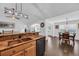 Open kitchen with granite countertops, modern appliances, and a view into the dining and living area at 174 Seville Dr., Murrells Inlet, SC 29576