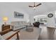 Comfortable living room with vaulted ceilings and hardwood floors that flows into the dining area at 174 Seville Dr., Murrells Inlet, SC 29576