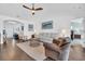 Bright living room featuring hardwood floors, ceiling fan, and modern decor at 174 Seville Dr., Murrells Inlet, SC 29576