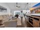 Spacious living room with high ceilings, neutral decor, hardwood floors, and a smooth transition to the dining area at 174 Seville Dr., Murrells Inlet, SC 29576