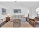 Bright and airy living room with hardwood floors, vaulted ceilings, and comfortable seating at 174 Seville Dr., Murrells Inlet, SC 29576