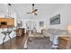 Open living room view into entryway, features hardwood floors, and comfortable seating at 174 Seville Dr., Murrells Inlet, SC 29576