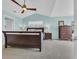 Spacious main bedroom featuring high ceilings, a ceiling fan, and soft blue walls at 174 Seville Dr., Murrells Inlet, SC 29576
