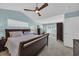 Bright main bedroom featuring ample natural light, ceiling fan, and a comfortable bed at 174 Seville Dr., Murrells Inlet, SC 29576