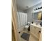 Cozy bathroom with patterned wallpaper and a shower-tub combo at 19 Pistachio Loop # G, Murrells Inlet, SC 29576