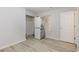 Bedroom featuring wood-look floors and a partially disassembled appliance at 19 Pistachio Loop # G, Murrells Inlet, SC 29576